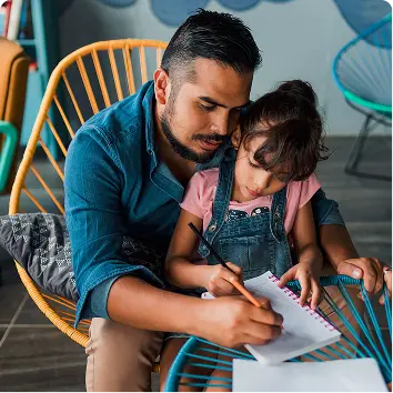 man helping child write